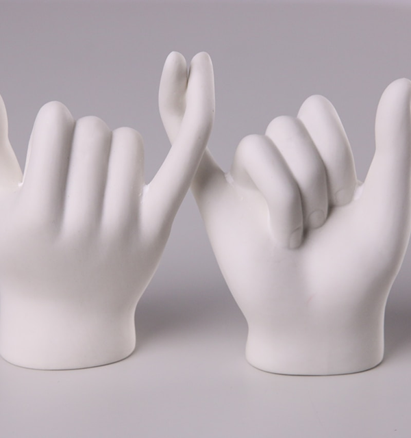 Two hands forming a promise gesture